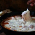 This Skillet Mini Meatball Dip is full of rich tomato sauce, Lots 3 kinds of cheese, and homemade mini meatballs! Perfect one skillet dip for a party that is sure to please! Skillet Mini Meatball Dip | Take Two Tapas