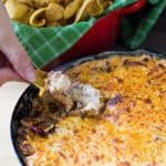The classic Frito Pie dish containing corn chips, chili, and cheese is transformed into a dip you can scoop into your mouth with reckless abandon! Frito Pie Dip Recipe | Take Two Tapas