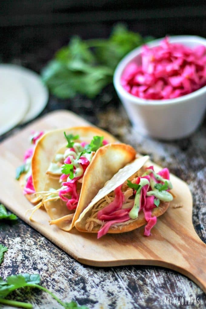 These non-traditional Asian tacos are a great alternative to the usual tacos. Won Ton wrappers for taco shells and filled with Lemongrass chicken, Pickled Red Cabbage, and a Cilantro Ginger Avocado Cream. Mini Asian Tacos with Won Ton Wrapper Shells Recipe | Take Two Tapas