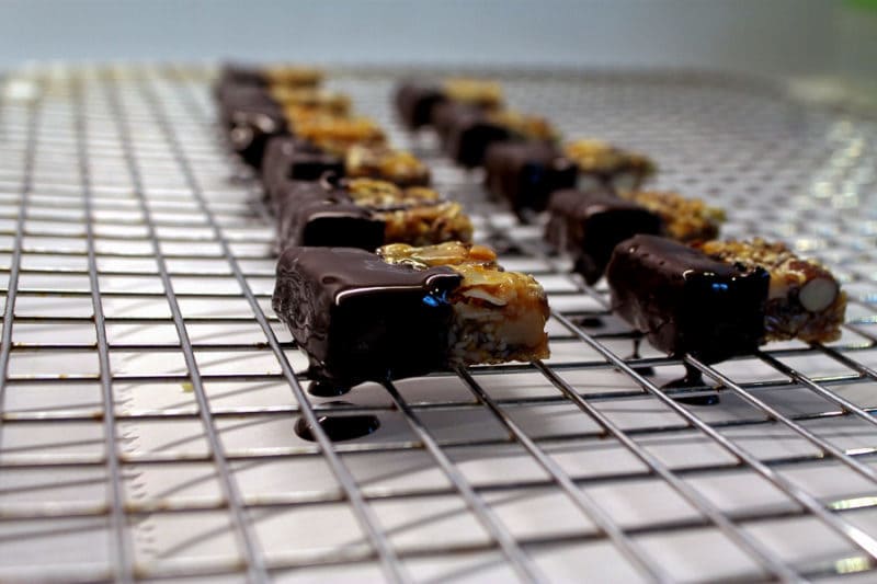 Dip the ends in Dark Chocolate - Paleo Snack Bites | Take Two Tapas | #Paleo #Chocolate #Granola #Nuts #Bars #Snacks