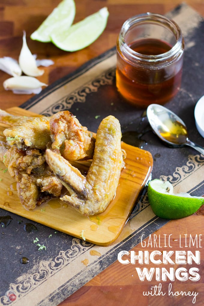 Chicken wings are always better with lots of garlic, a dash of lime and dripping with the sticky sweetness of honey! Grab some wings and a ton of napkins unless you want to lick your fingers clean. Garlic Lime Chicken Wings with Honey Recipe | Take Two Tapas | #Garlic #Lime #ChickenWings #Sweet #Spicy #Honey #ChickenWingSauce