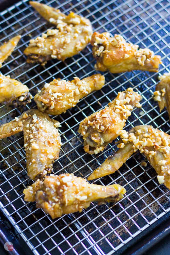 Crispy baked orange cashew chicken wings rolled in roasted cashews for crunch! | Take Two Tapas | #Orange #Cashew #ChickenWings #ChineseTakeOut #ChineseFood #ChickenWingSauce #FingerFoods