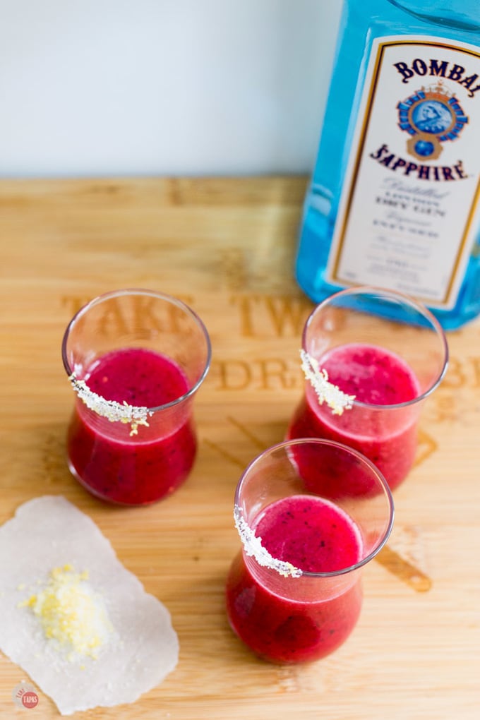 The tart and herbaceous flavors of a classic gin and tonic are balanced with the sweetness of mixed berries. Mixed Berry Gin & Tonic Cocktail Shots Recipe | Take Two Tapas | #MixedBerry #GinandTonic #Gin #Tonic #CocktailRecipes #CocktailShots #Gin&Tonic #PartyDrinks #Gin&Tonic #G&T