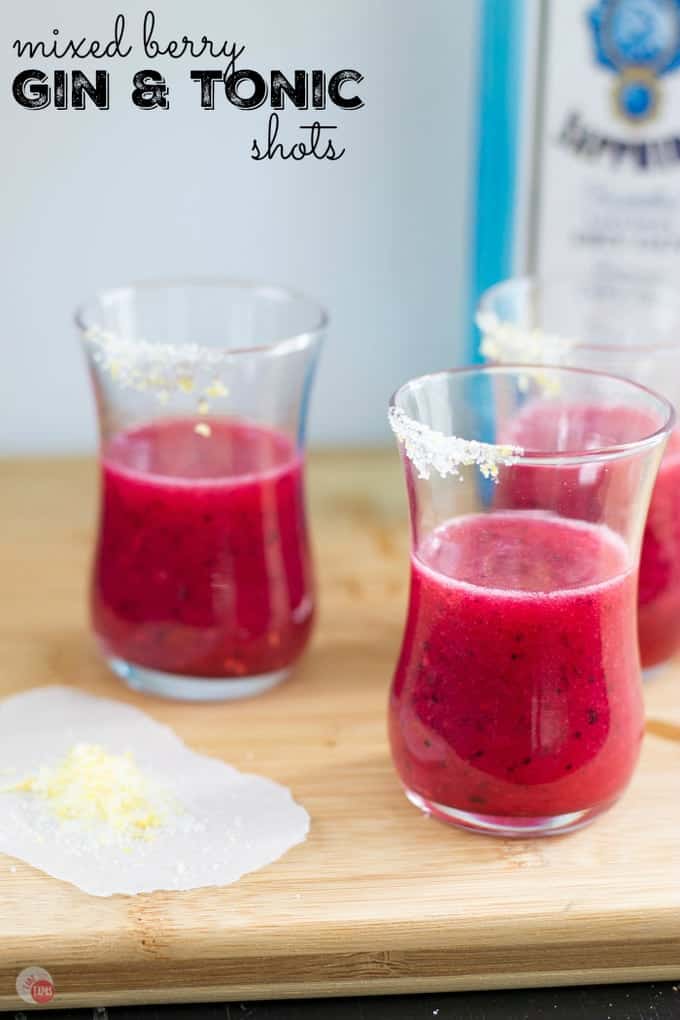 The tart and herb flavors of a classic gin and tonic are balanced with the sweetness of mixed berries in these gorgeous purple mixed berry gin and tonic cocktail shots! Mixed Berry Gin & Tonic Cocktail Shots Recipe | Take Two Tapas | #MixedBerry #GinandTonic #Gin #Tonic #CocktailRecipes #CocktailShots #Gin&Tonic #PartyDrinks #Gin&Tonic #G&T