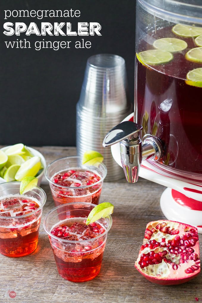 A large batch of Pomegranate Ginger Ale Sparkler will help you celebrate your holiday party with ease! Pomegranate Sparkler Cocktail Recipe | Take Two Tapas | #PomegranatePunch #PomegranateSparkler #LargeBatchPunch #HolidayPunch #HolidayEntertainingTips #GingerAlePunchRecipe #PunchRecipe