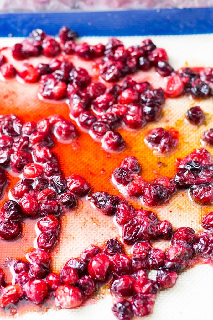 Roasted cranberries pair nicely with tart cranberry juice, caramel hinted bourbon, and bubbly lemon-lime soda. Perfect a large batch of punch! Roasted Cranberry Bourbon Crush Recipe | Take Two Tapas