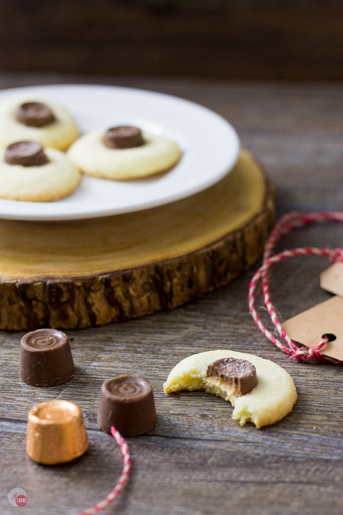 Meet your new favorite cookie exchange member! Salted Rolo Thumbprint Cookies | Take Two Tapas | #RoloCandy #ThumbprintCookies #CookieRecipe #Salted #Chocolate #Caramel #CookieExchangeRecipe
