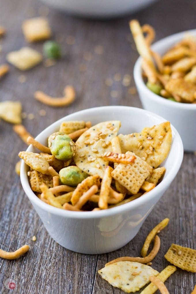 My Asian Wasabi Chex Mix is loaded with sesame seeds, rice crackers, crunchy chow mein noodles, crispy wasabi peas, and coated with a soy wasabi sauce! Get ready to be addicted to the Far East! | Take Two Tapas | #AsianSnackMix #ChexMixRecipe #WasabiChexMix #NewSnackRecipes #SpicySnackMix