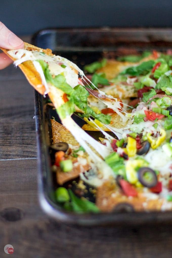 Your favorite Italian Sub Sandwich has been transformed into nachos! Italian Sheet Pan Nachos Recipe | Take Two Tapas | #SheetPanNachos #Italian #nachos #Wontons