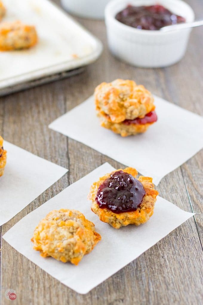 Sausage ball sliders with jelly filling are a great way to change up your breakfast routine! It's Spring so that means turning over a new leaf and setting some new breakfast goals. Make a change along with the season and start your day off with a change in your breakfast! Sausage Ball and Jelly Breakfast Sliders | Take Two Tapas