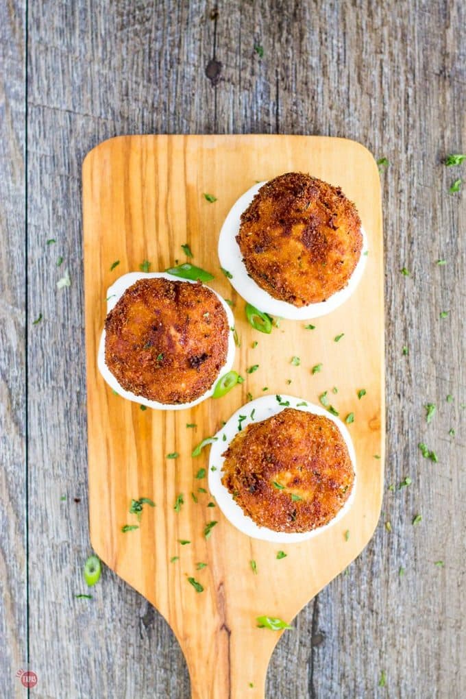 Mashed Potatoes are mixed with Southwest seasoning and fried to a crispy golden brown to make the perfect appetizer. Served with a spicy cool green chile ranch dip they are amazing! Southwest Potato Croquettes with Green Chile Ranch Dip Recipe | Take Two Tapas | #Southwest #PotatoCroquette #MashedPotatoes #PotatoRecipe #Appetizer #GreenChilies #RanchDip