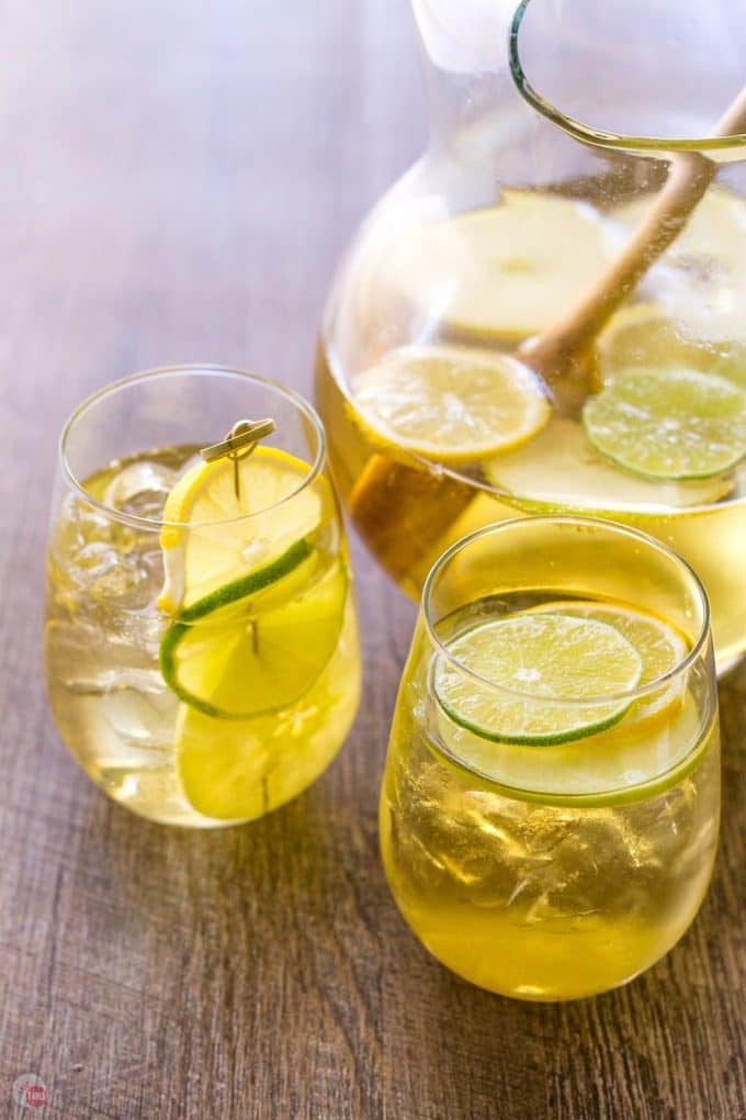 Summer Apple Sangria in 2 glasses and a glass pitcher