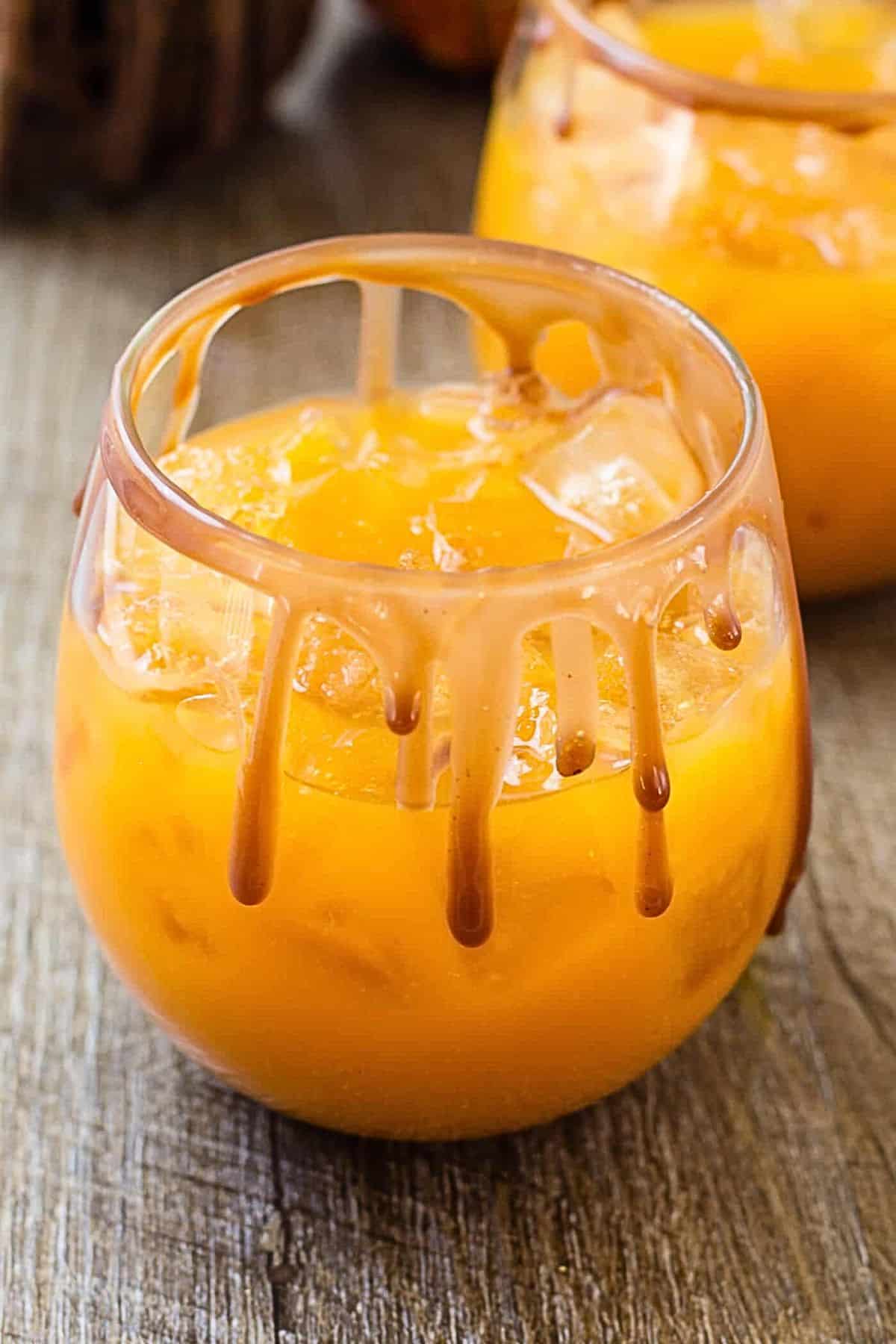 close up of caramel sauce on the rim of a wine glass