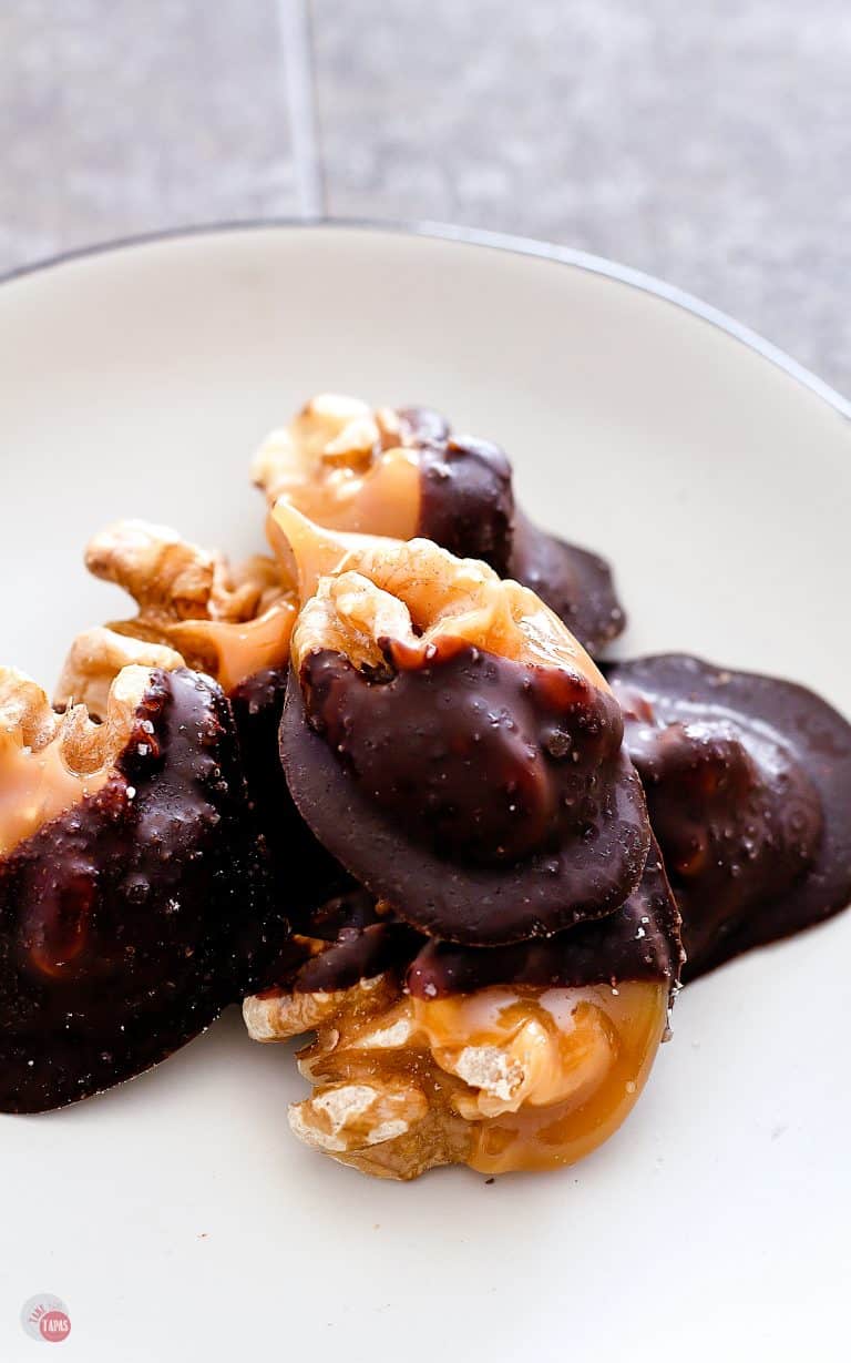 close up picture of Individual Salted Dark Chocolate Walnut Amaretto Turtles on a white plate