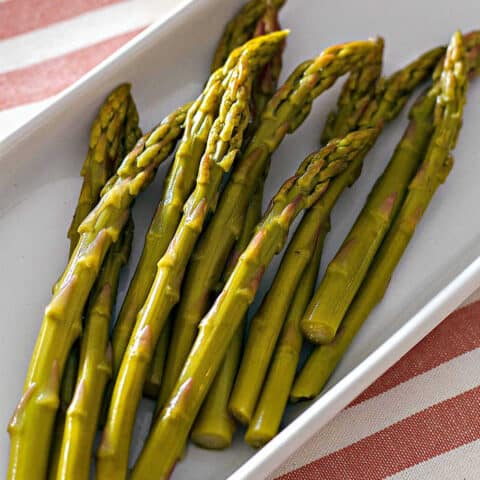 close up of pickled asparagus spears