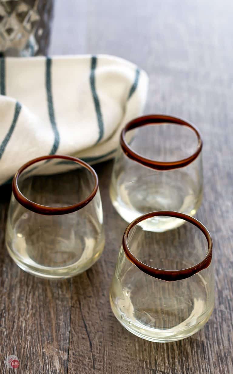 three glasses of shot on a table