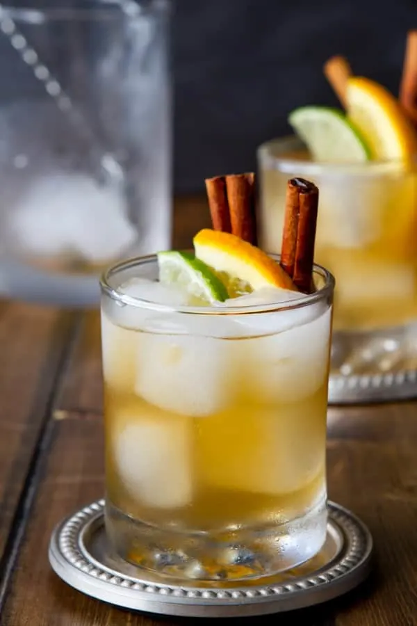 Kentucky Mule cocktail with lime, orange and cinnamon stick garnish