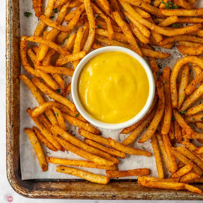 pan of cajun fries with dipping sauce