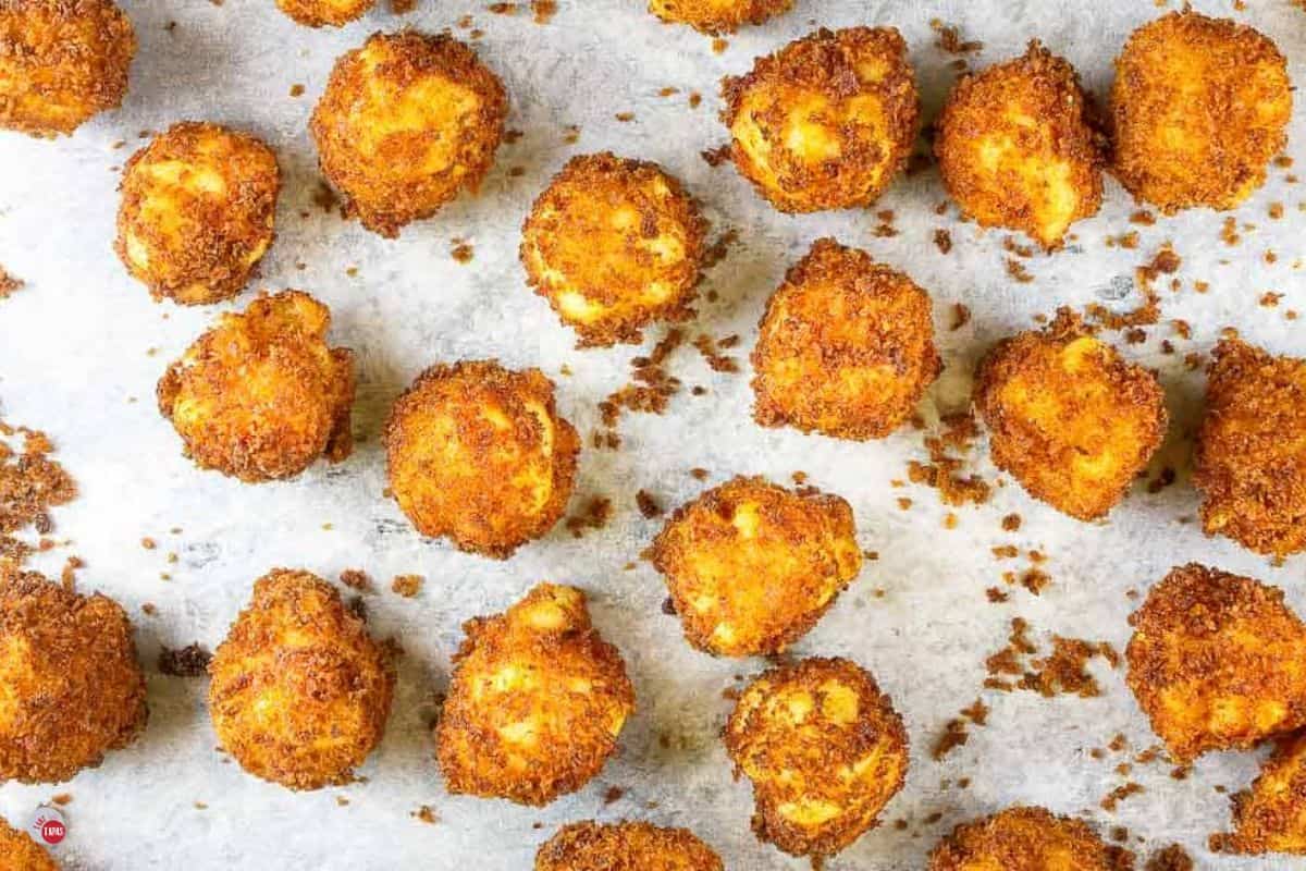 baking sheet with fried mac and cheese bites on it