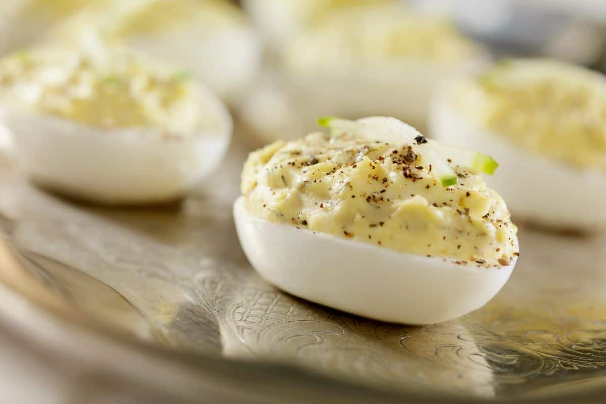 filled egg on sliver platter