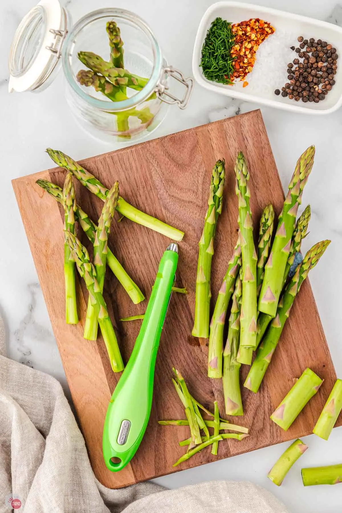 vegetable peeler trimming asparagus spears