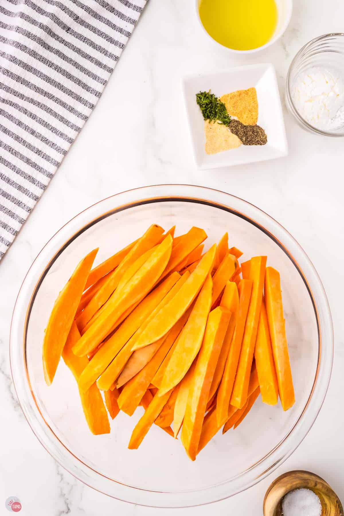 sweet potatoes cut into strips and placed in a bowl