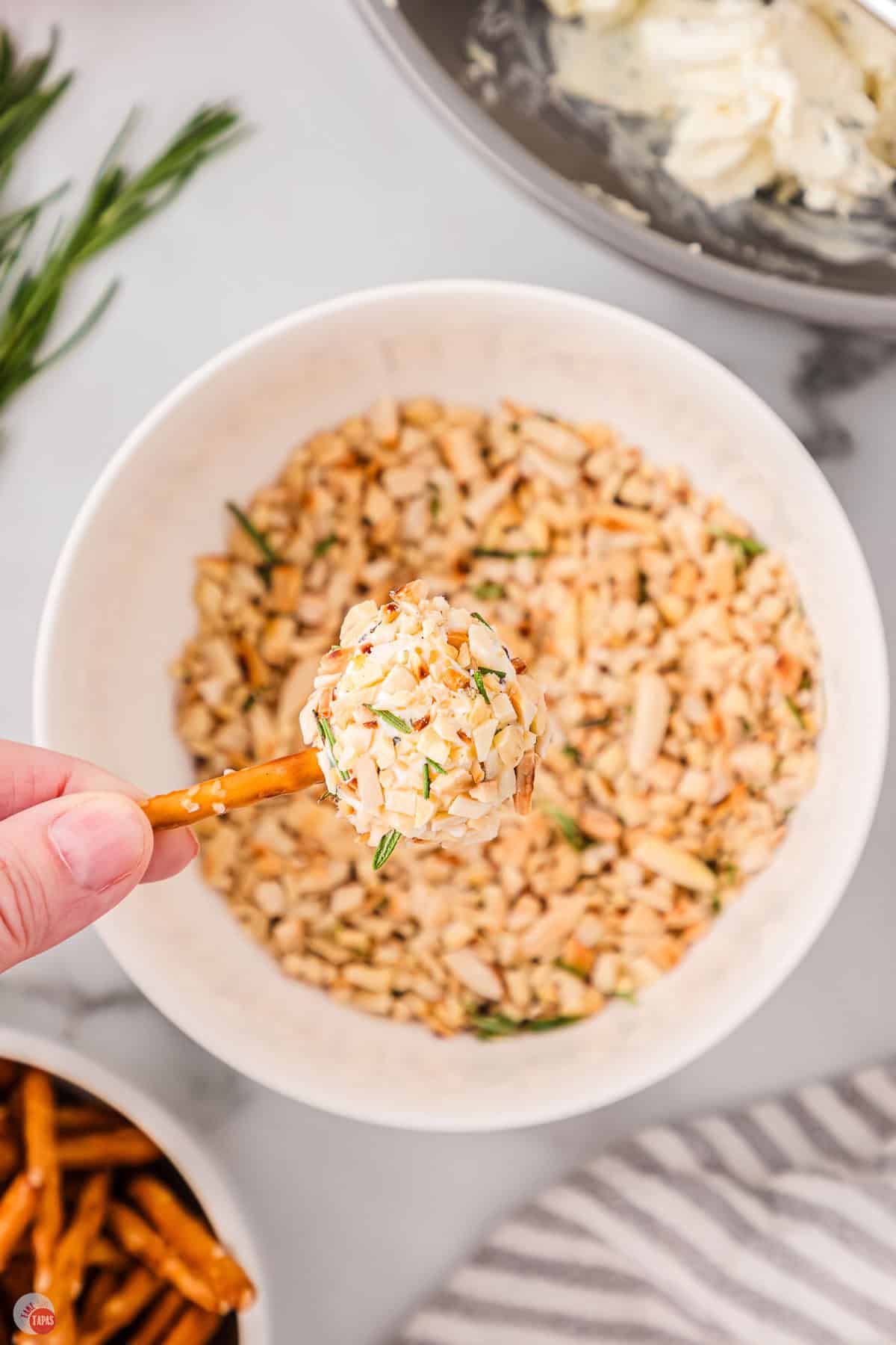 mini cheeseball bites with a pretzel stick