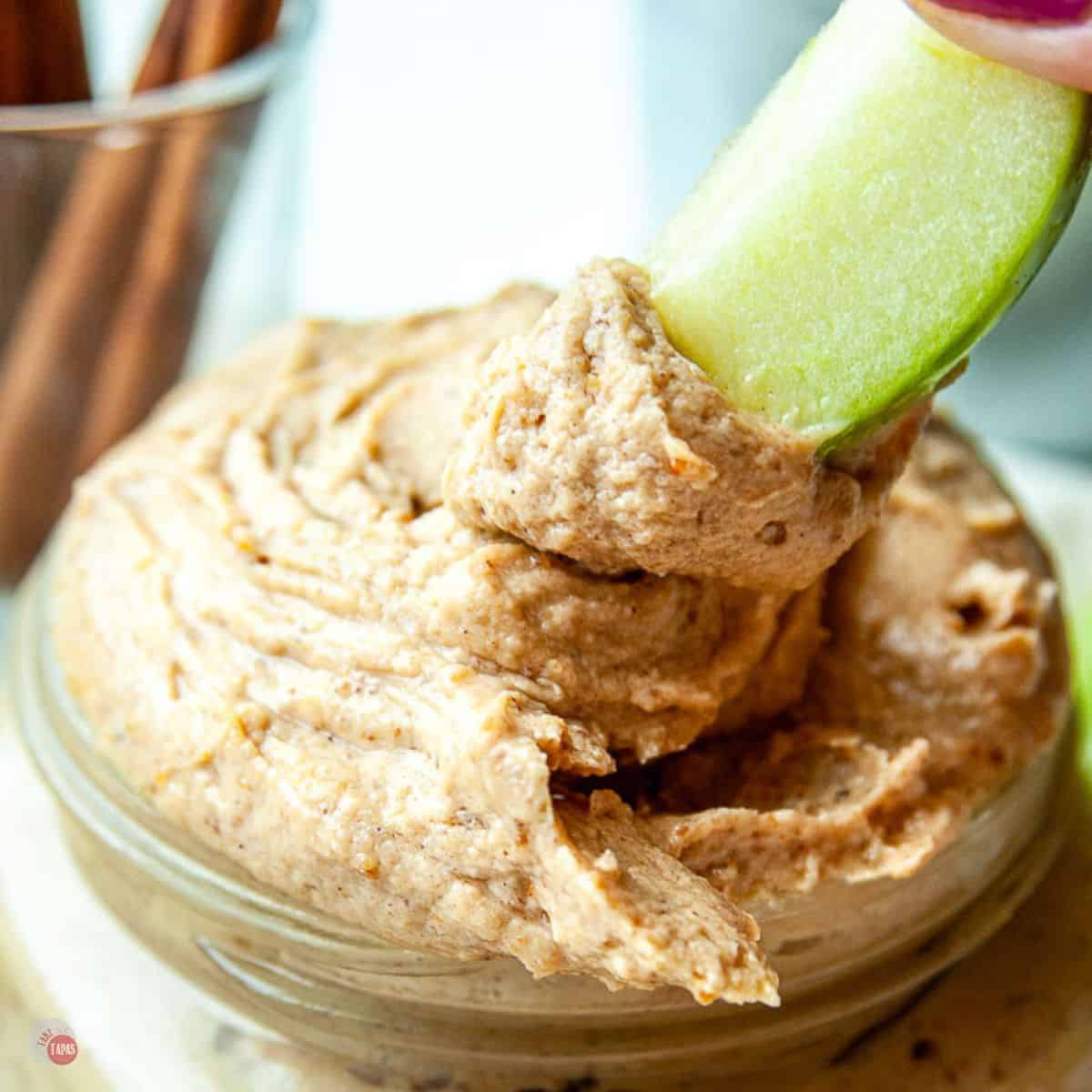 fluffy peanut butter dip with an apple slice