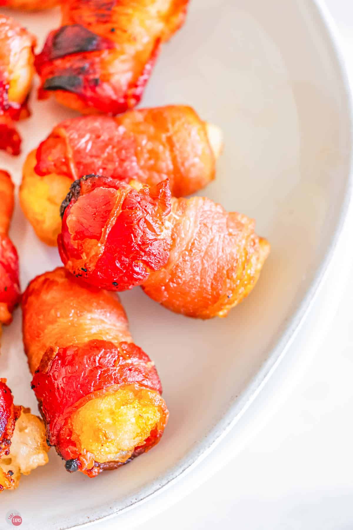 close up of bacon wrapped tater tots