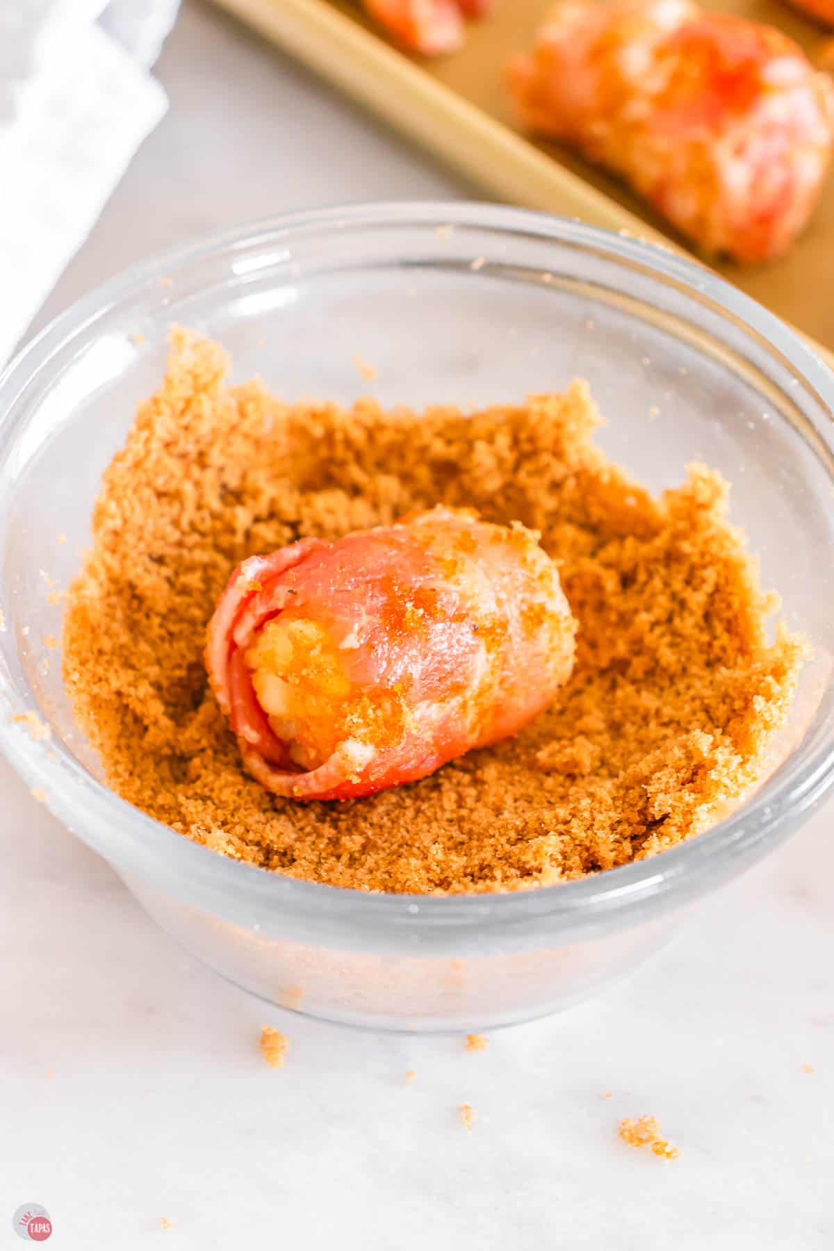 bacon and potato tot in a bowl of brown sugar