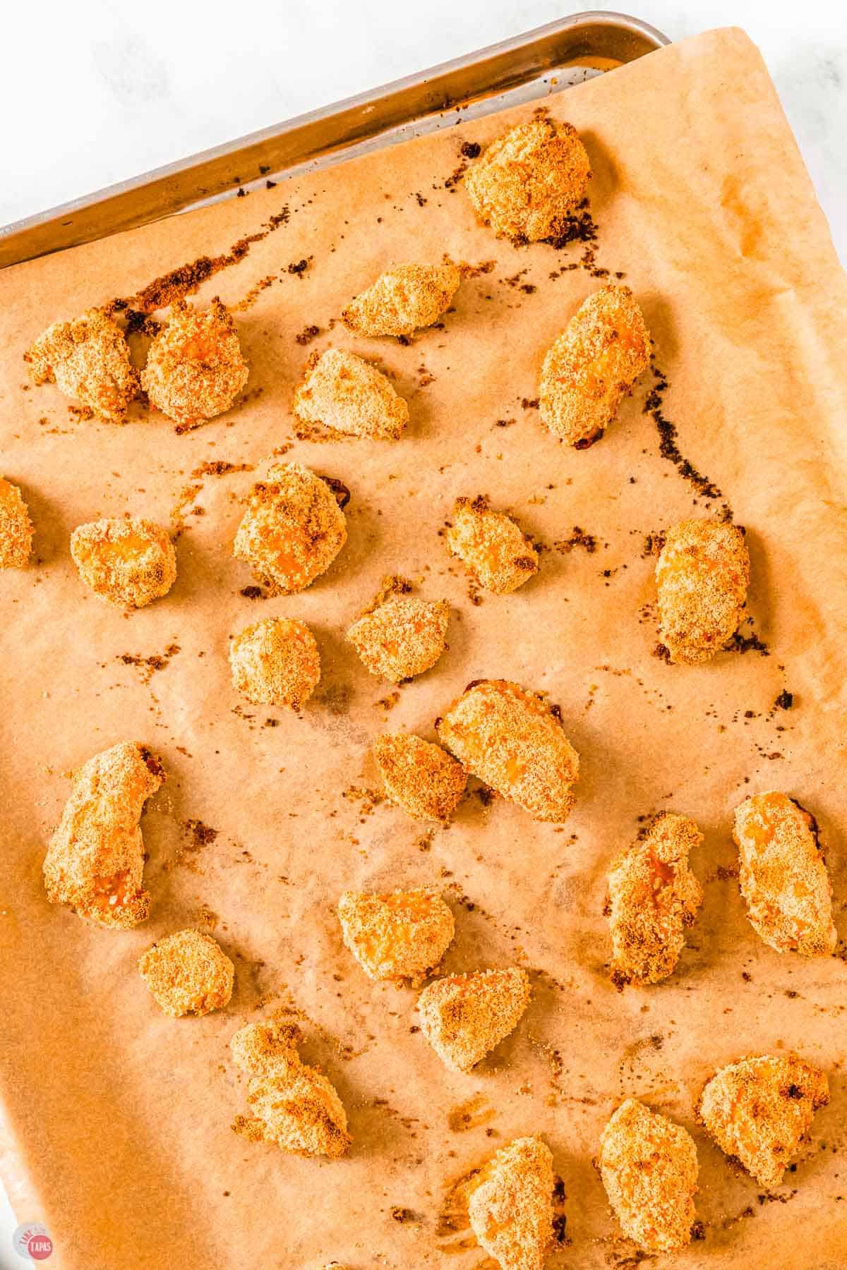 baked chicken nuggets on a baking sheet