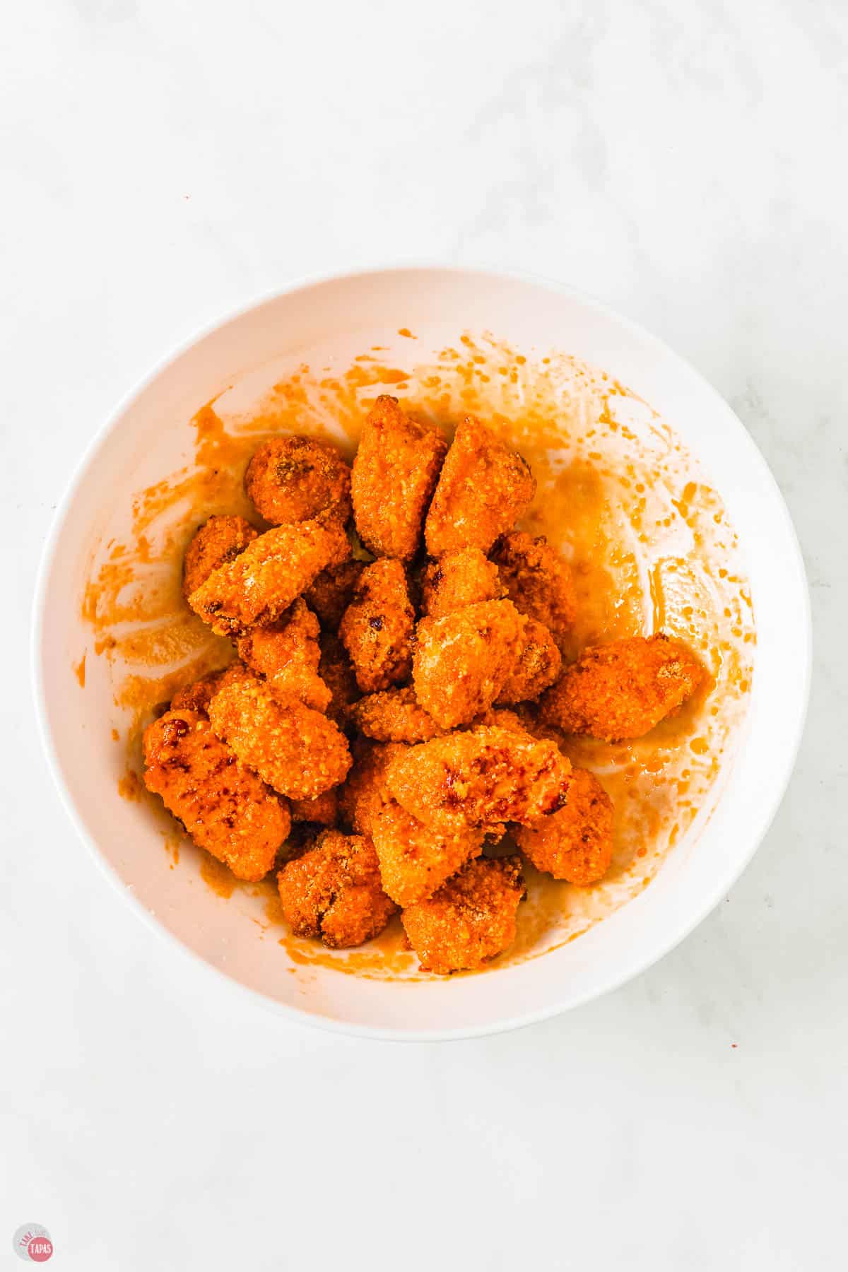 chicken nuggets tossed in sauce