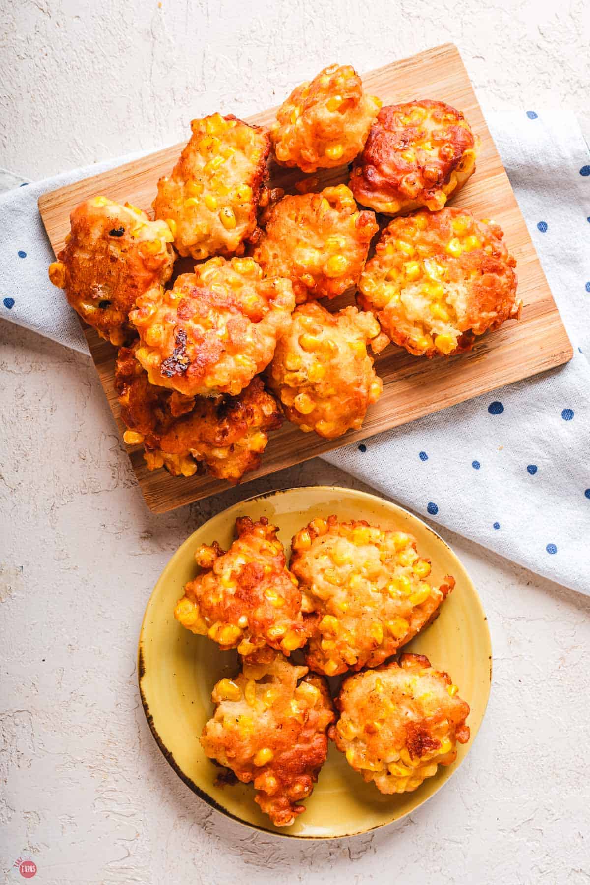 wood board with stack of corn nuggets