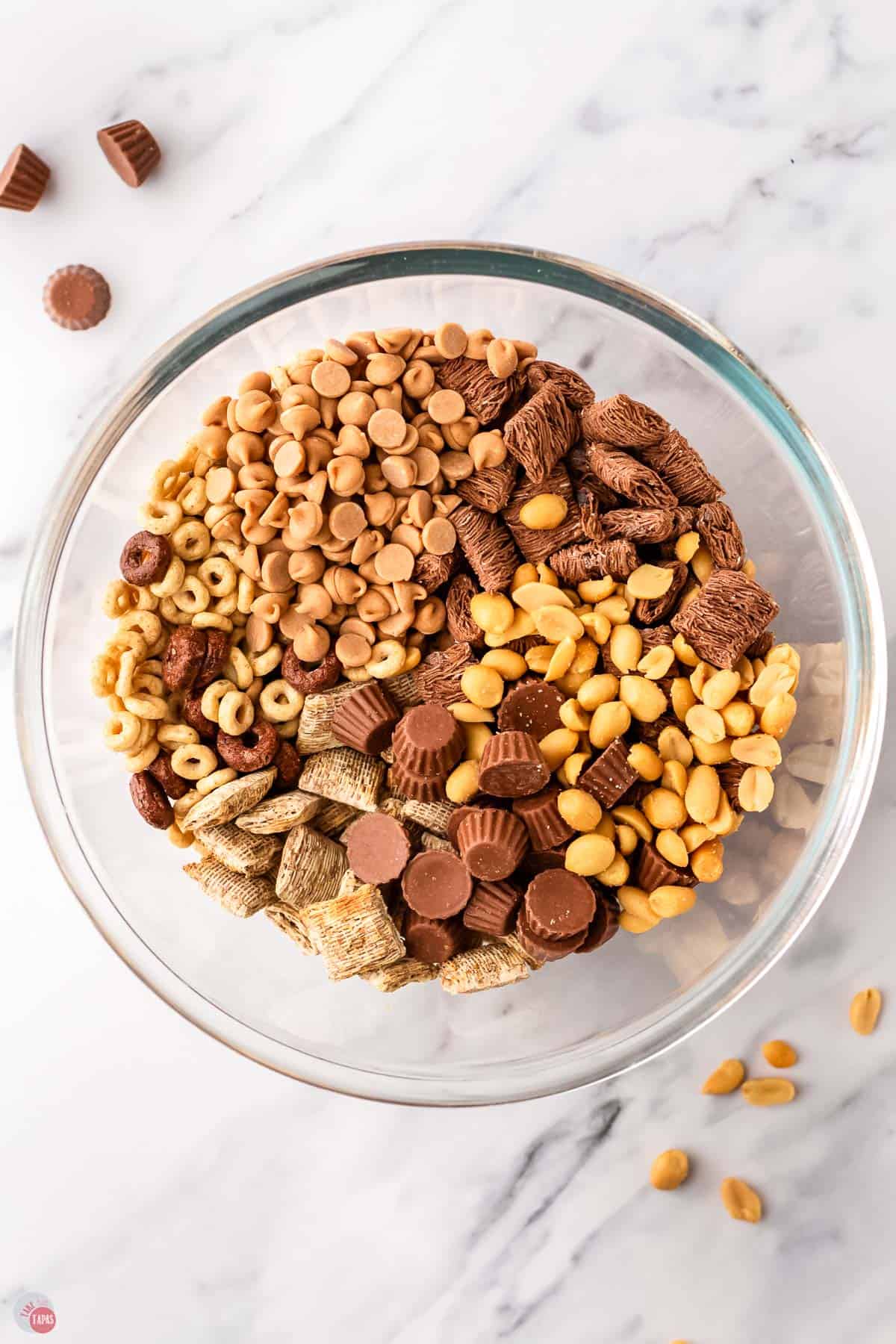 unmixed snack mix ingredients in a bowl