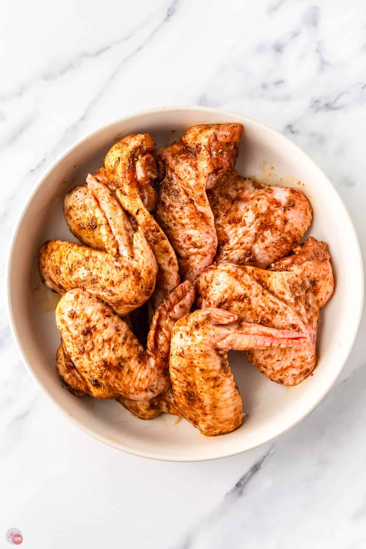 bowl of marinated chicken wings