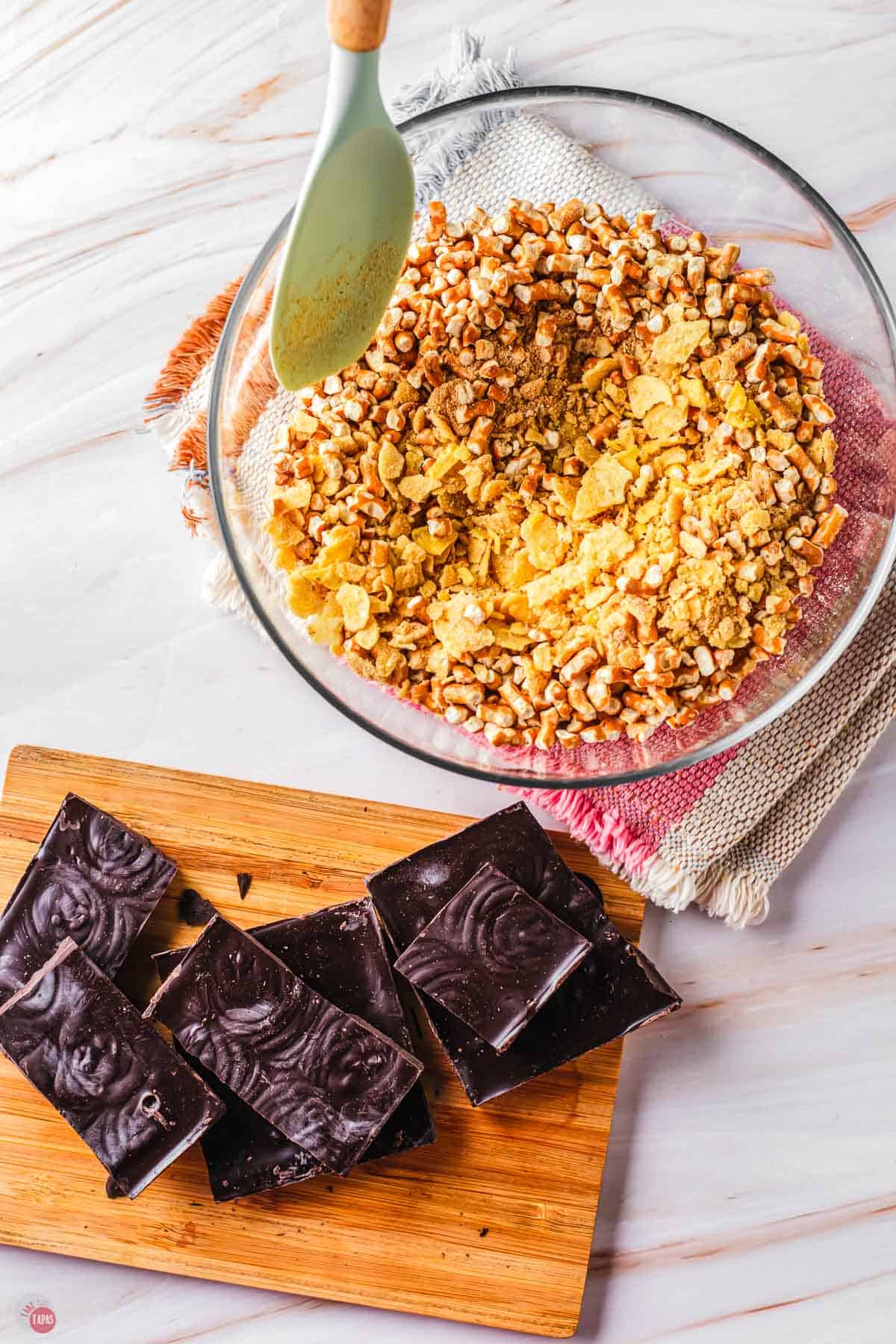 bowl of crushed snacks with broken up chocolate bar