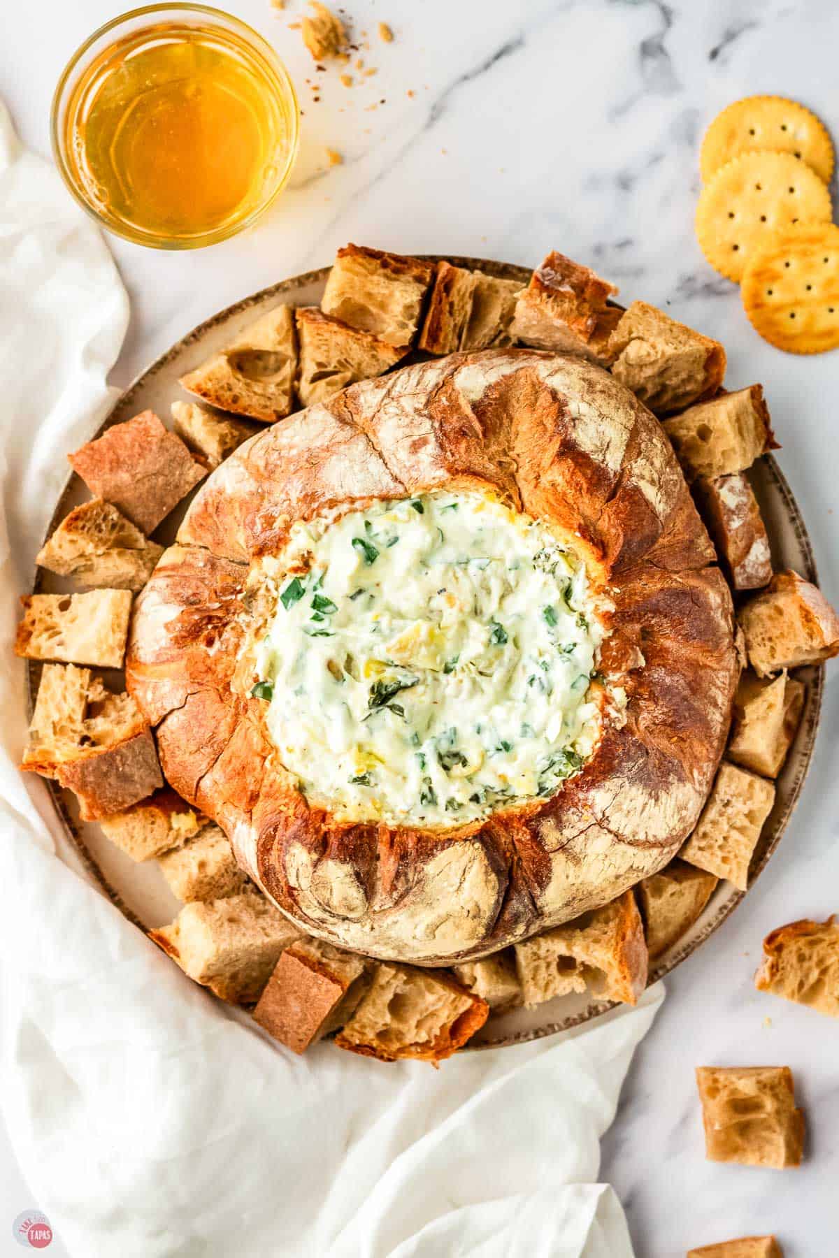 baked spinach dip in a bread bowl