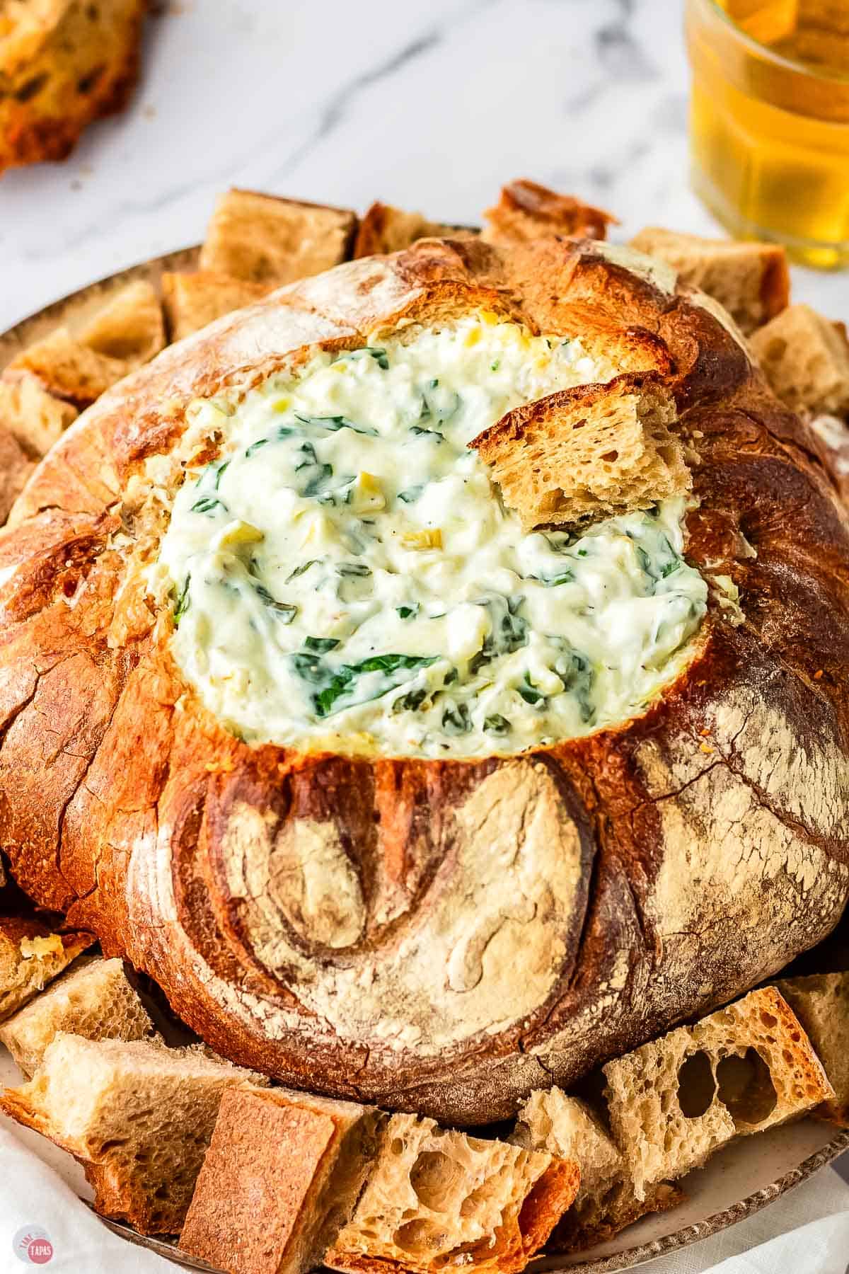 spinach artichoke dip in a bread bowl