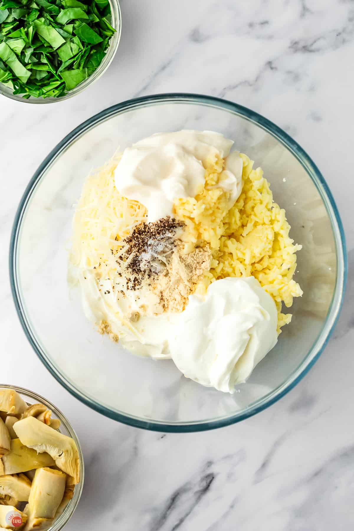 mayonnaise, cream cheese, and spices in a clear bowl